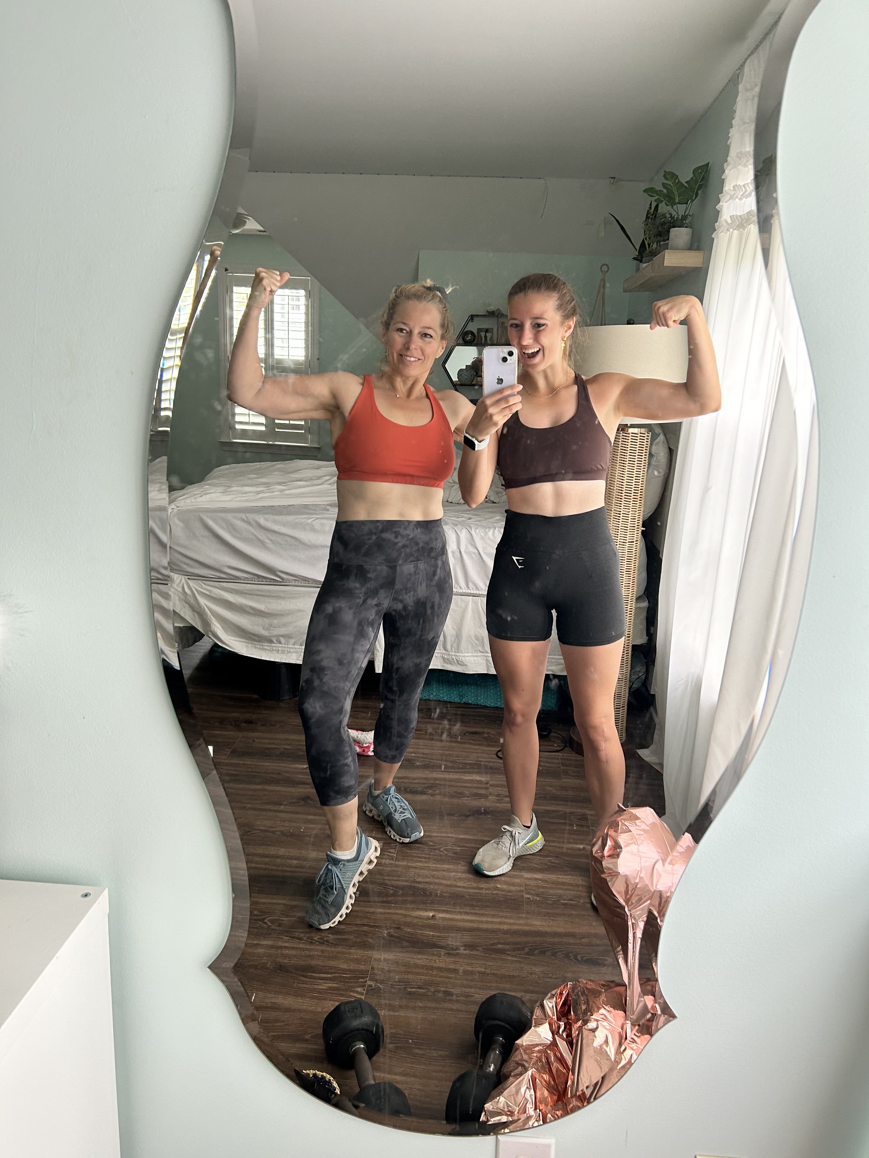 Cyndee and Mae in mirror before a run